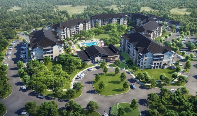 aerial view of pool and building with several trees