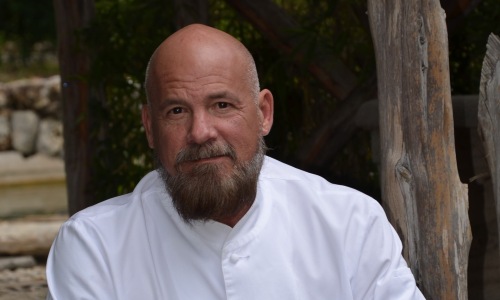 a chef posing for a picture