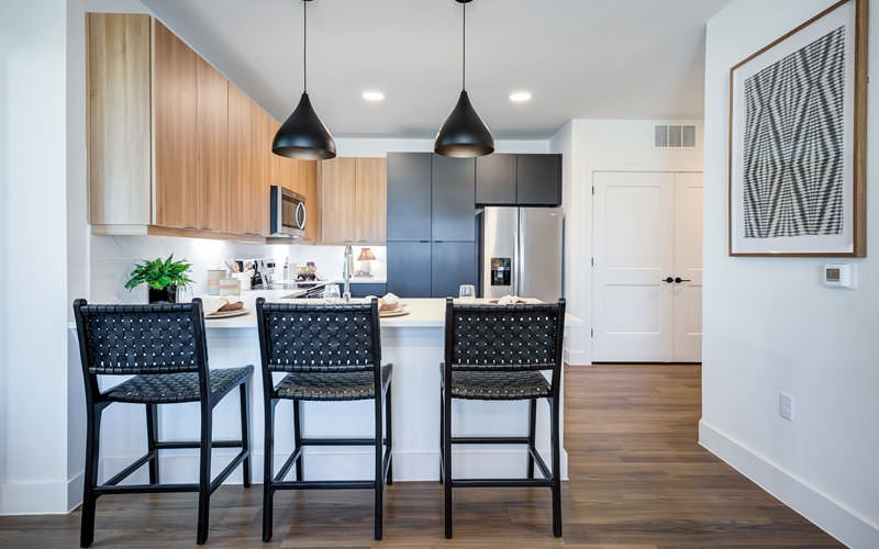 a kitchen with wooden cabinets